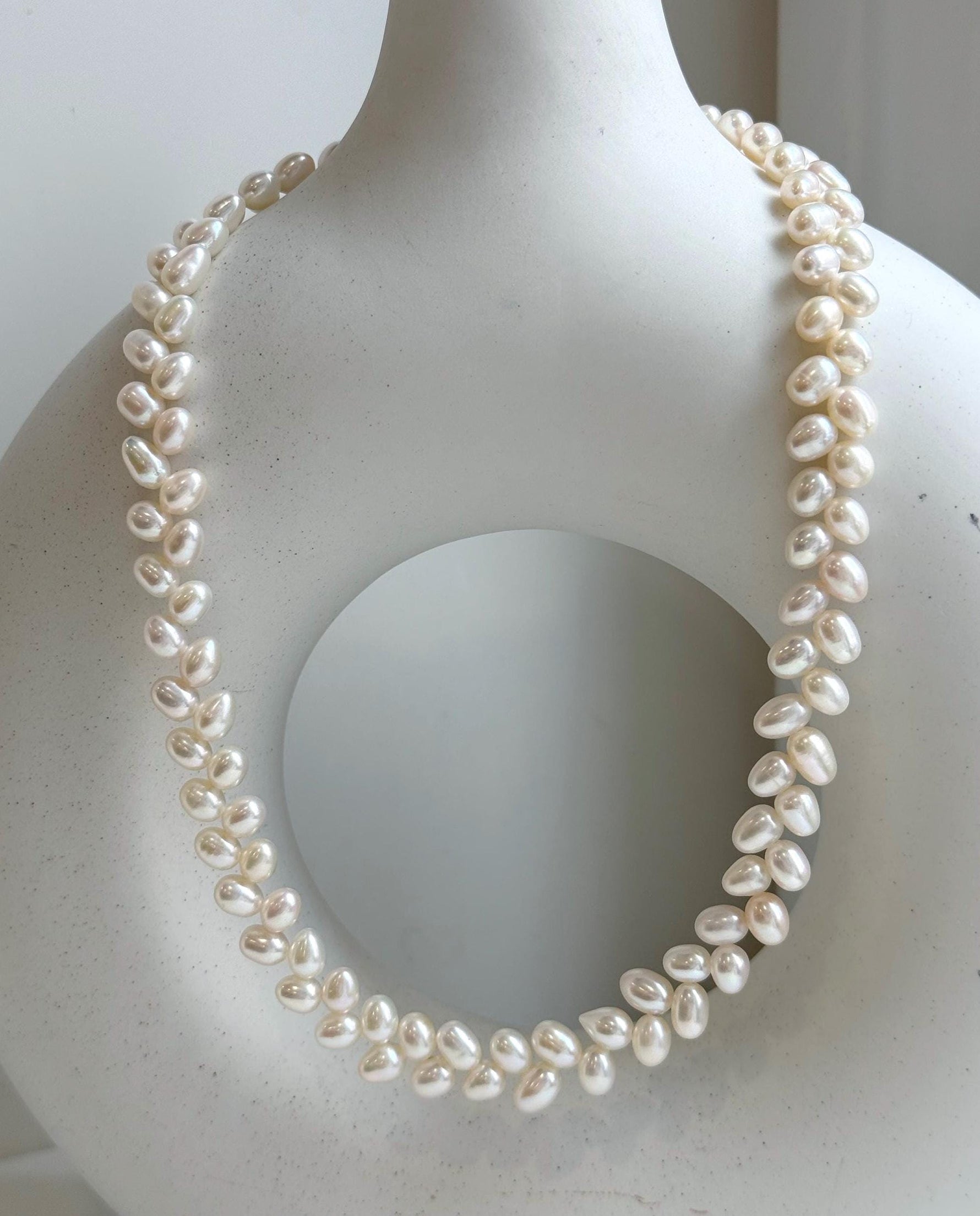 Elly’s White rice Keshi Pearls wheat design Necklace: Extreme luster Mirrored effect, 5-5.5mm, S925 silver clips, to 17.7”long.