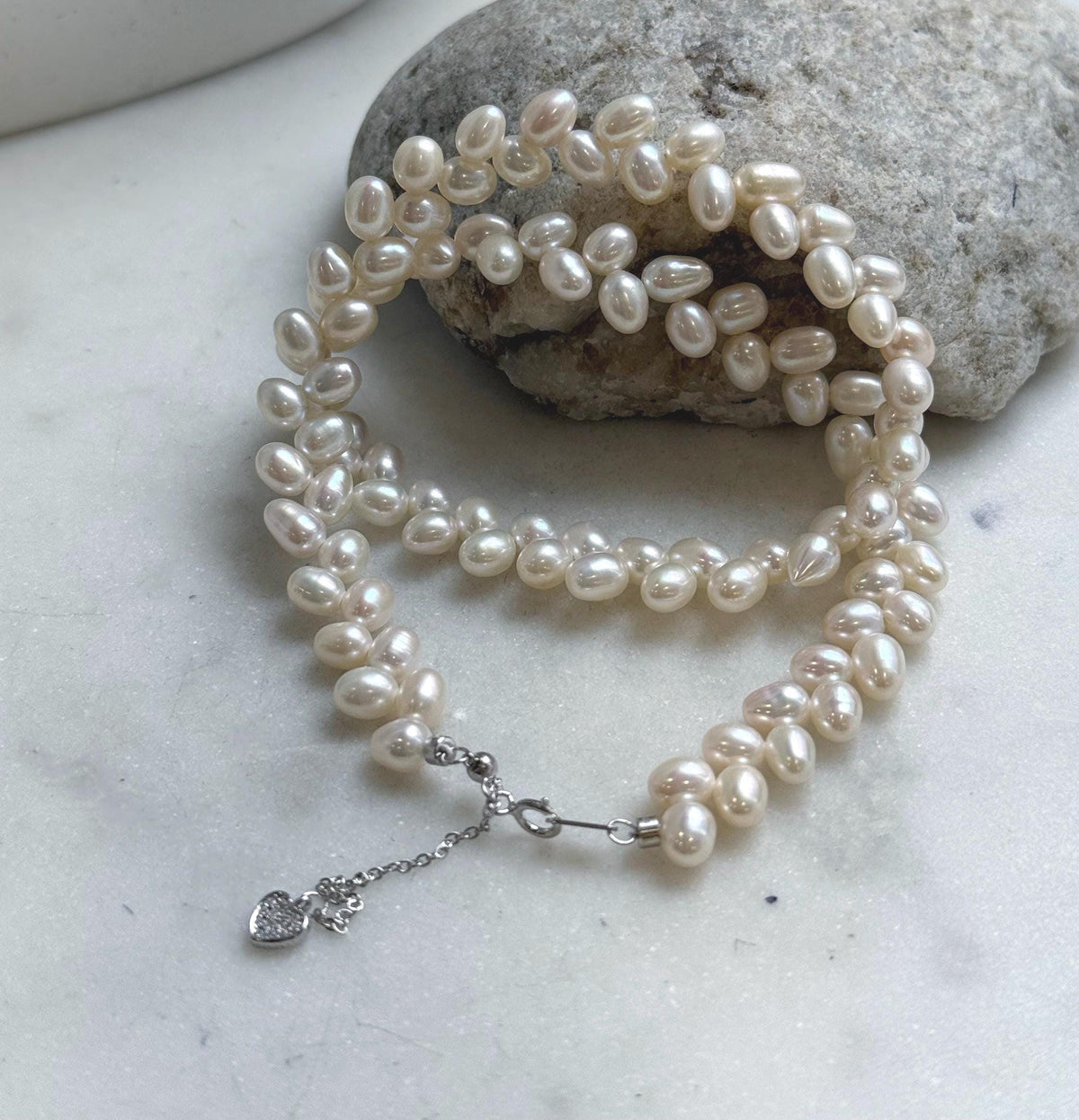 Elly’s White rice Keshi Pearls wheat design Necklace: Extreme luster Mirrored effect, 5-5.5mm, S925 silver clips, to 17.7”long.