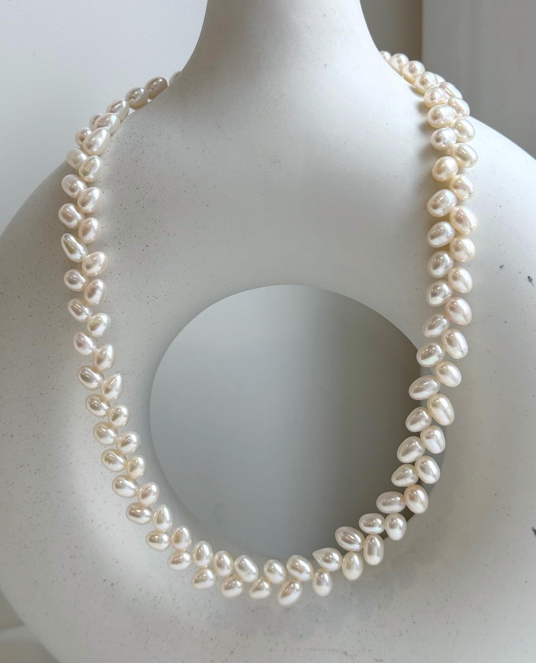 Elly’s White rice Keshi Pearls wheat design Necklace: Extreme luster Mirrored effect, 5-5.5mm, S925 silver clips, to 17.7”long.