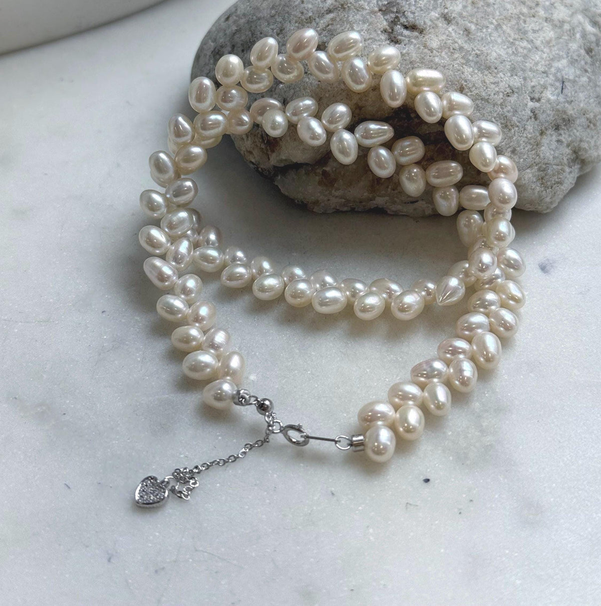 Elly’s White rice Keshi Pearls wheat design Necklace: Extreme luster Mirrored effect, 5-5.5mm, S925 silver clips, to 17.7”long.