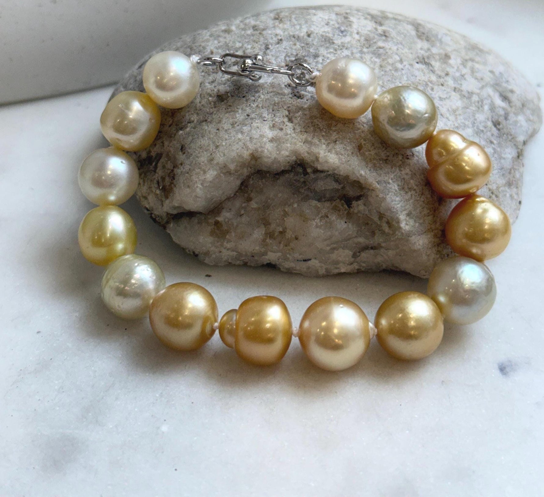 Elly’s 11.8-13.3mm 14pcs South sea golden Ocean Pearls bracelet: Extreme luster, light to deep golden pearls, 8.3”, S925 silver bracelet.