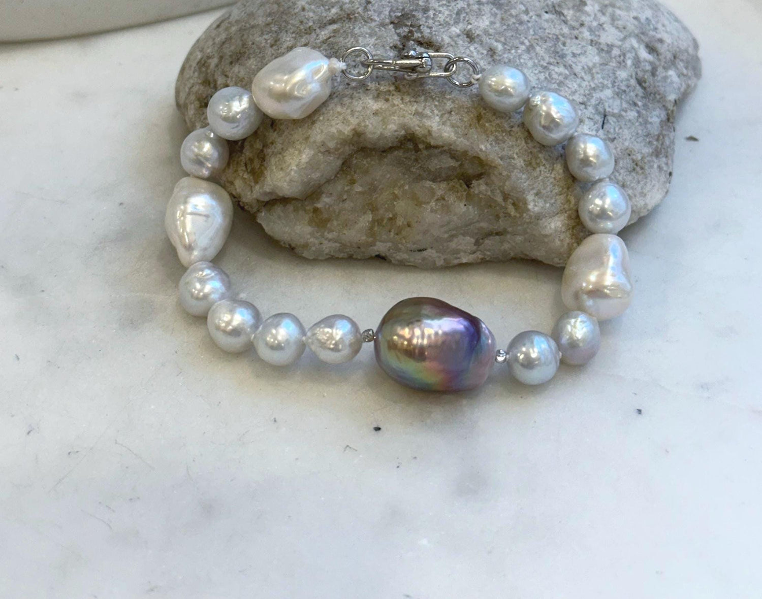 Elly’s 8-14.6mm White metallic rainbow iridescent Pearls Bracelet: Extreme luster mirrored, 8.5” knotted, S925 silver Bracelet.