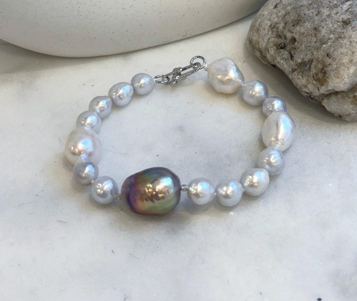 Elly’s 8-14.6mm White metallic rainbow iridescent Pearls Bracelet: Extreme luster mirrored, 8.5” knotted, S925 silver Bracelet.