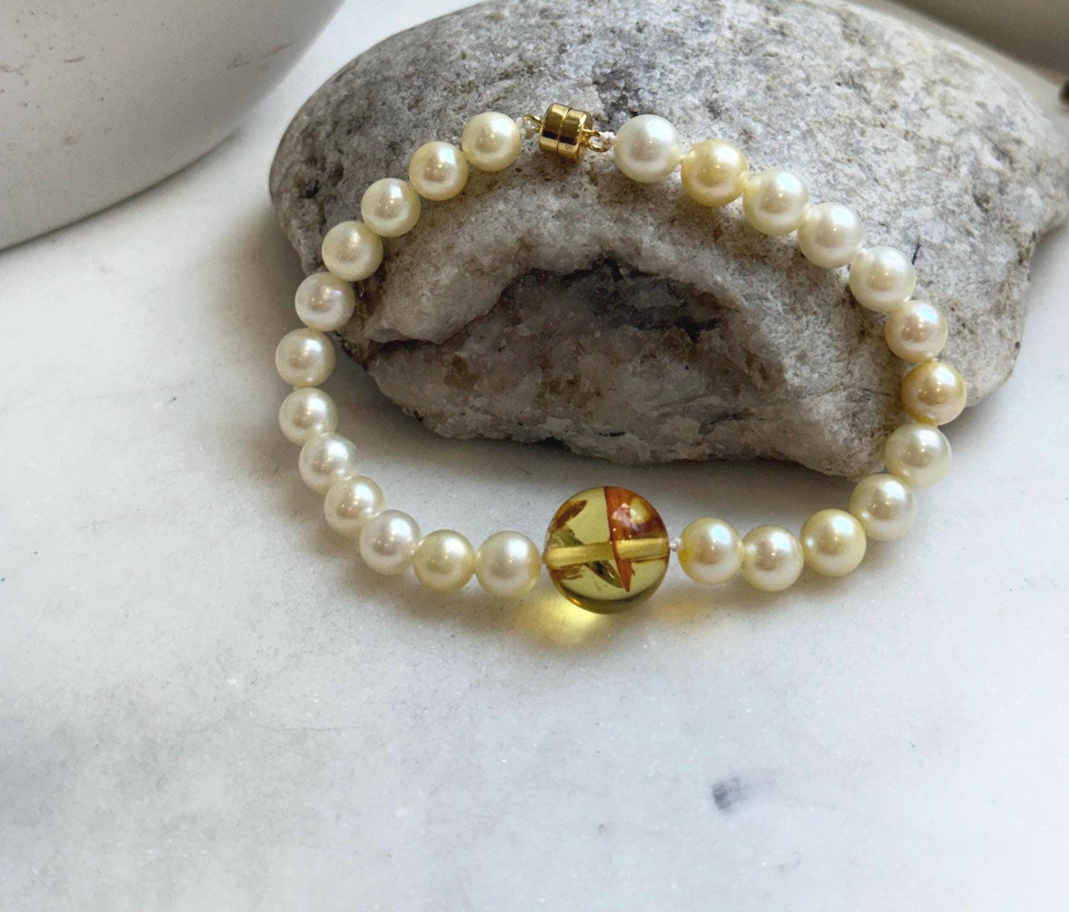 Elly’s 6.6-7mm Genius Akoya golden ocean Pearls Natural Amber Bracelet: Extreme luster mirrored, 7.6” knotted, S925 silver magnetic clips.