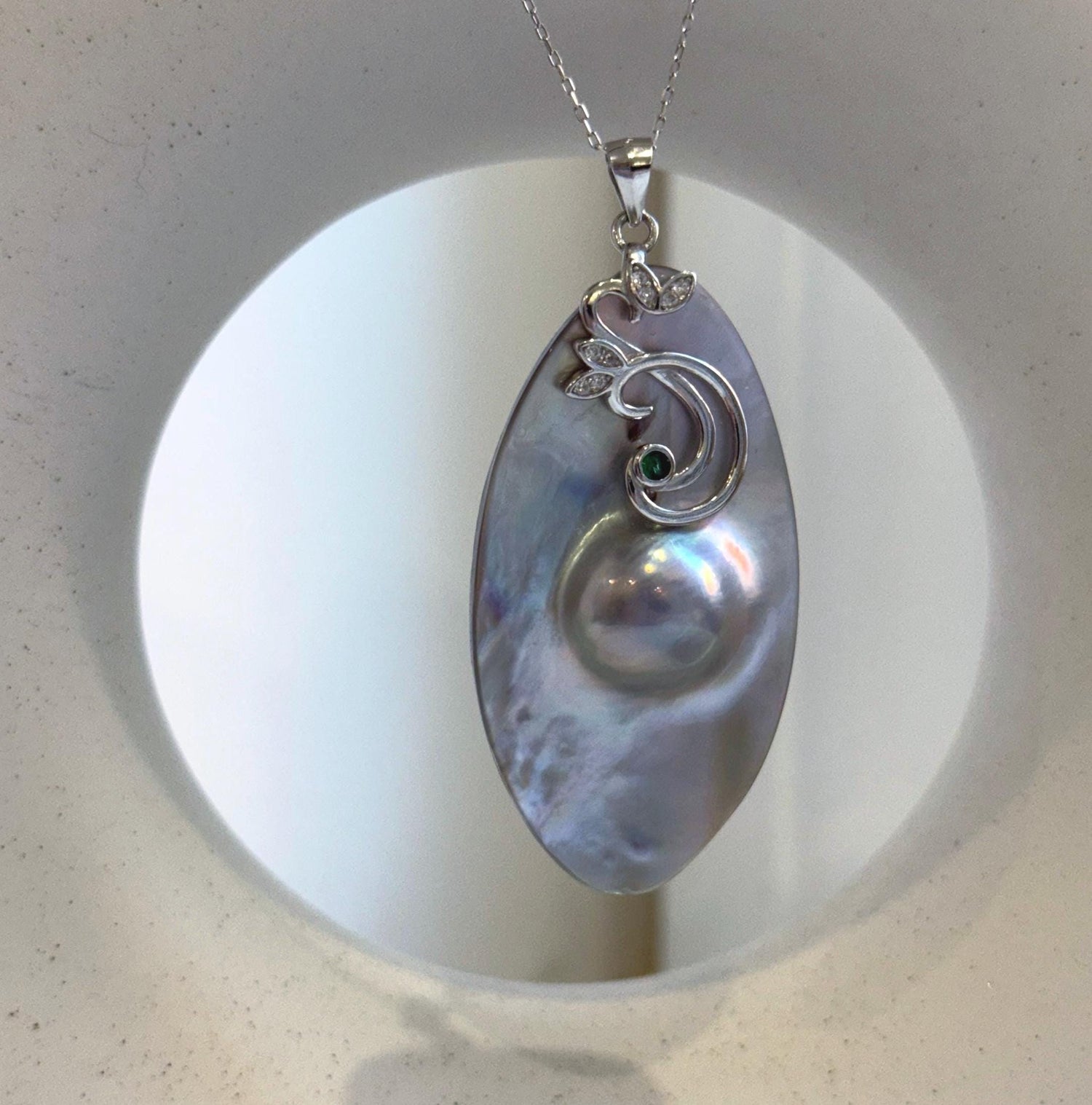 Elly’s 26.6x50mm silver iridescent  Australian Ocean Mabe Pendant : Extreme luster, S925 silver floral pendant, with chain.