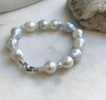 Elly’s 12pcs Australian Ocean white silver Pearls Bracelet: Extreme luster mirrored, to 18.2mm, 8.4” knotted, S925 silver clip. good for her birthdays gift
