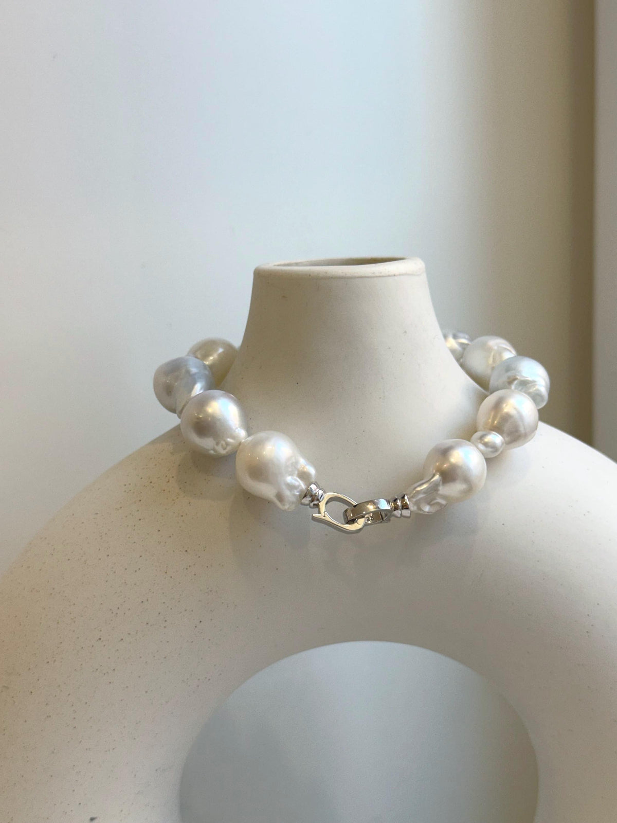 Elly’s 12pcs Australian Ocean white silver Pearls Bracelet: Extreme luster mirrored, to 18.2mm, 8.4” knotted, S925 silver clip.
