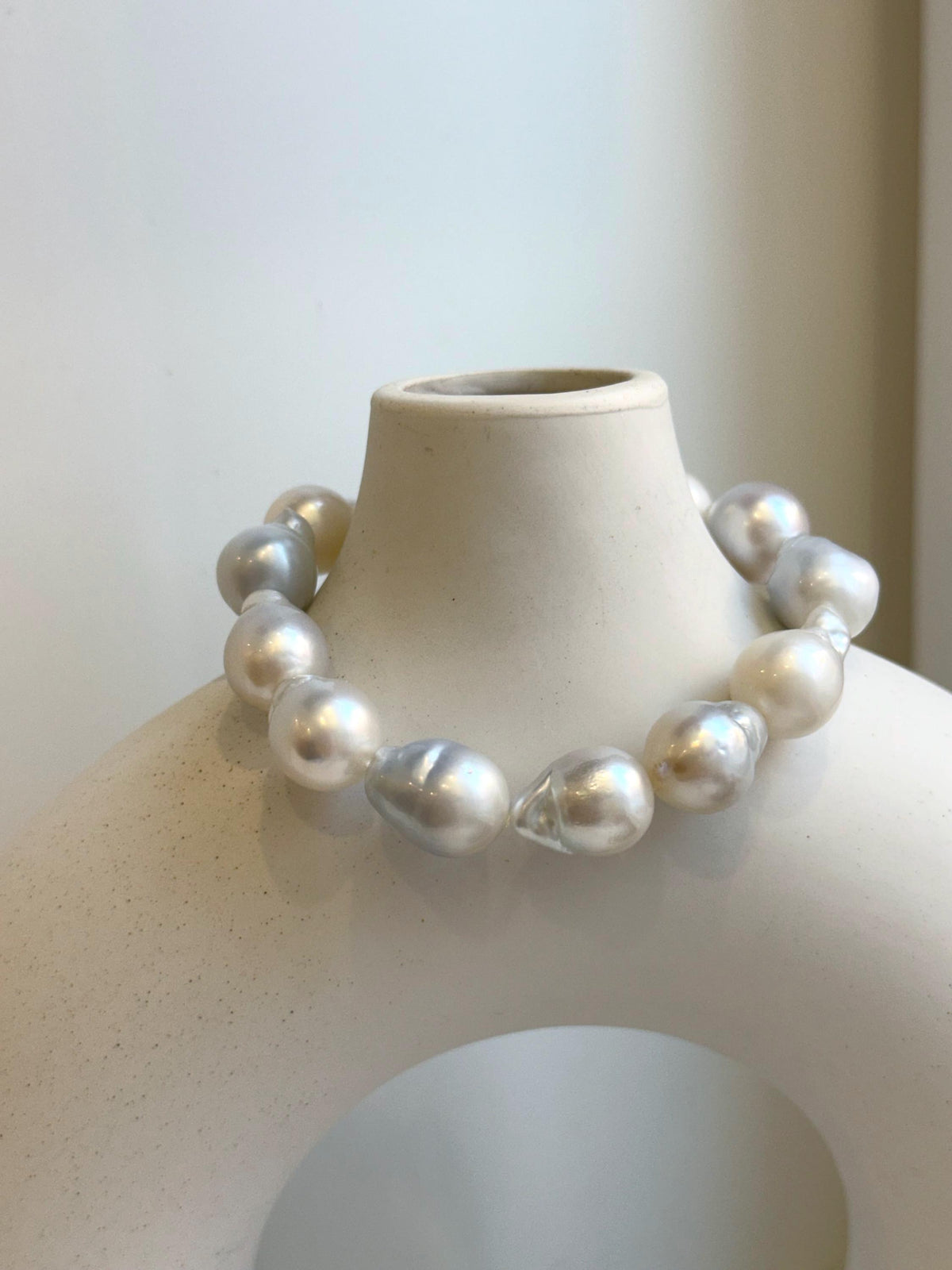 Elly’s 12pcs Australian Ocean white silver Pearls Bracelet: Extreme luster mirrored, to 18.2mm, 8.4” knotted, S925 silver clip.