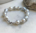 Elly’s 12pcs Australian Ocean white silver Pearls Bracelet: Extreme luster mirrored, to 18.2mm, 8.4” knotted, S925 silver clip.