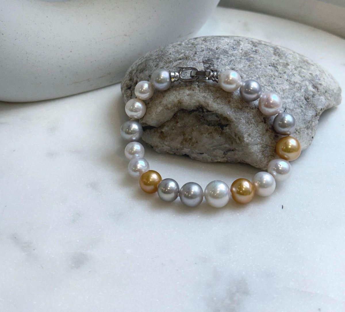 Elly’s 18pcs 8.3-10.5mm White gold silver Edison Pearls Bracelet: Extreme luster mirrored, 7.6” knotted, S925 silver Bracelet.