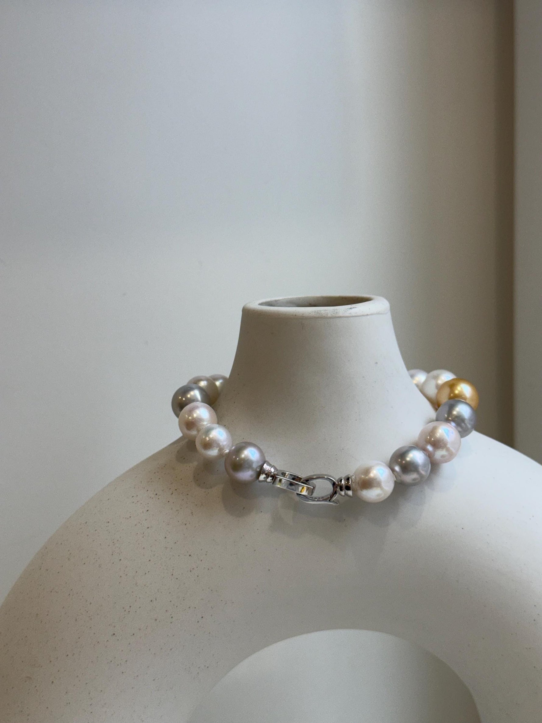 Elly’s 18pcs 8.3-10.5mm White gold silver Edison Pearls Bracelet: Extreme luster mirrored, 7.6” knotted, S925 silver Bracelet.