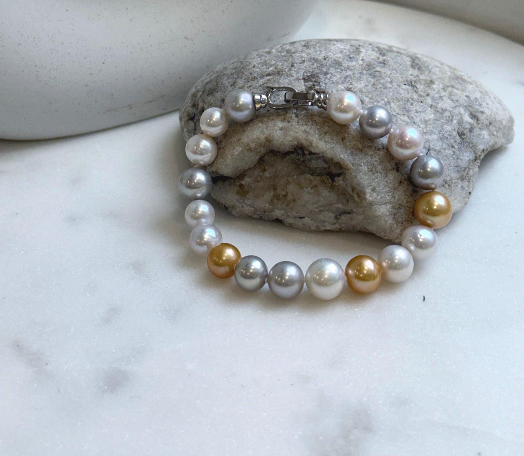 Elly’s 18pcs 8.3-10.5mm White gold silver Edison Pearls Bracelet: Extreme luster mirrored, 7.6” knotted, S925 silver Bracelet.