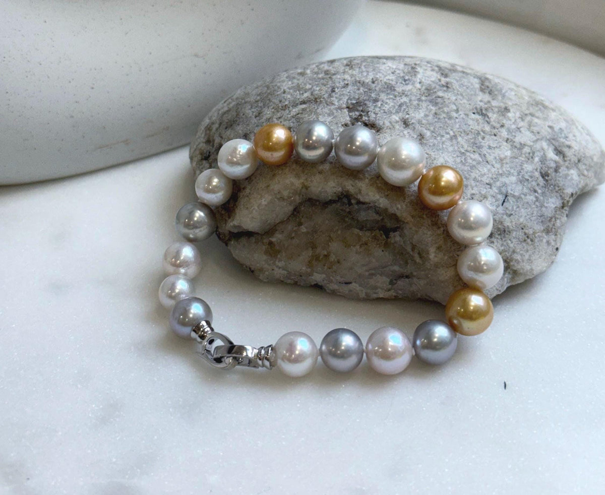 Elly’s 18pcs 8.3-10.5mm White gold silver Edison Pearls Bracelet: Extreme luster mirrored, 7.6” knotted, S925 silver Bracelet.