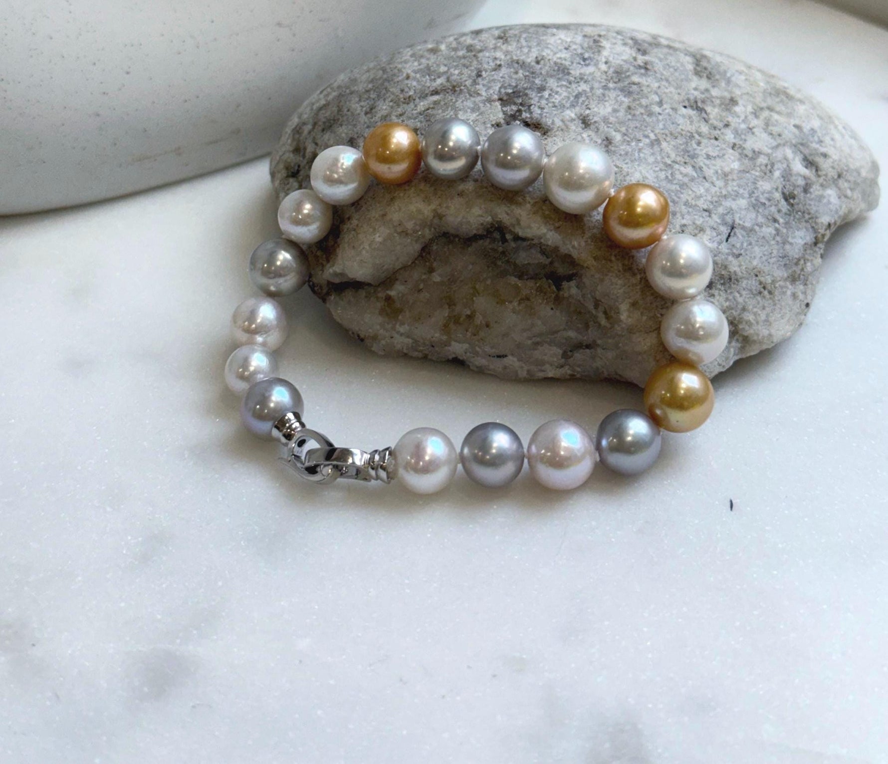 Elly’s 18pcs 8.3-10.5mm White gold silver Edison Pearls Bracelet: Extreme luster mirrored, 7.6” knotted, S925 silver Bracelet.