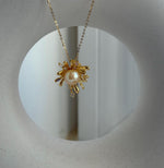 Elly’s 8.8mm South sea gold iridescent Pearl Fireworks Pendant: Extreme luster mirrored, 2.3cm high, S925 silver Pendant with silver chain.