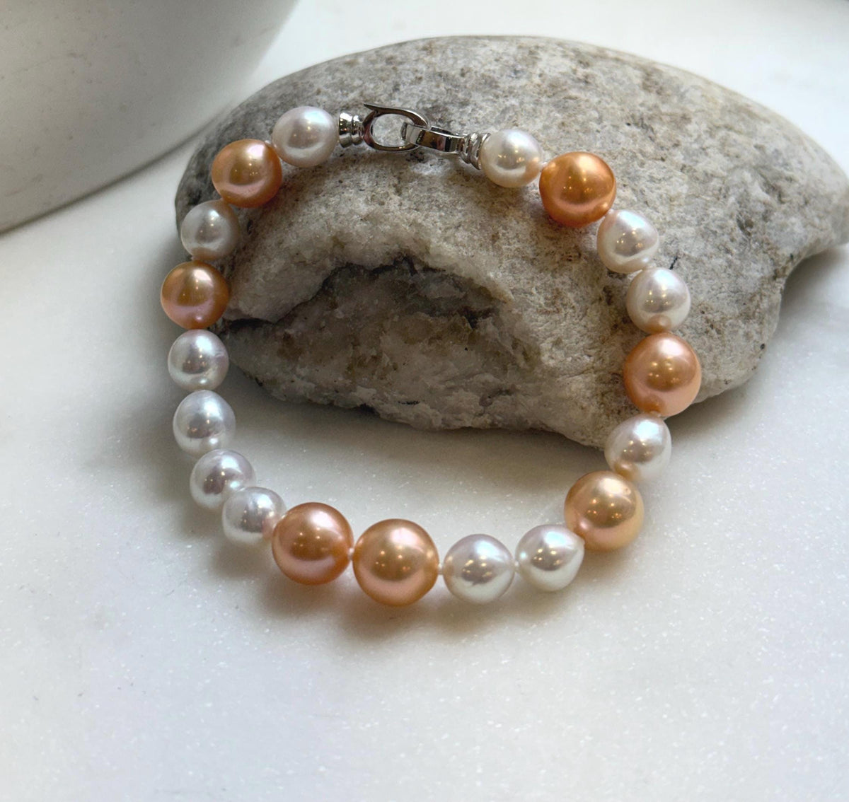 Elly’s 19pcs 8-10.2mm Natural Sunset peach gold White Edison Pearls Bracelet: Extreme luster mirrored, 8” knotted, S925 silver Bracelet. daily office colored pearls bracelet