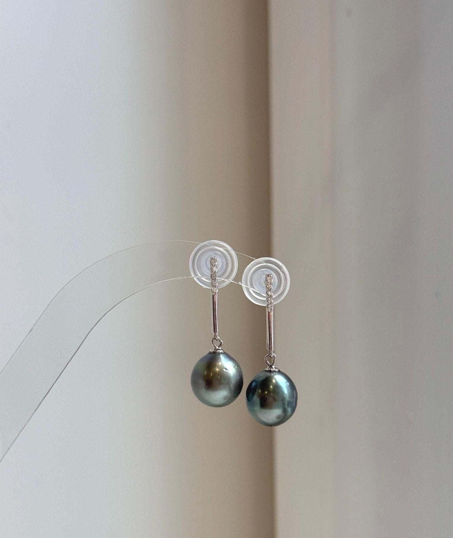 Elly’s 10.4mm Tahitian Peacock green hunter ocean pearls earrings: Extreme luster mirrored, S925 silver fireworks earrings. Pearl jewelry.