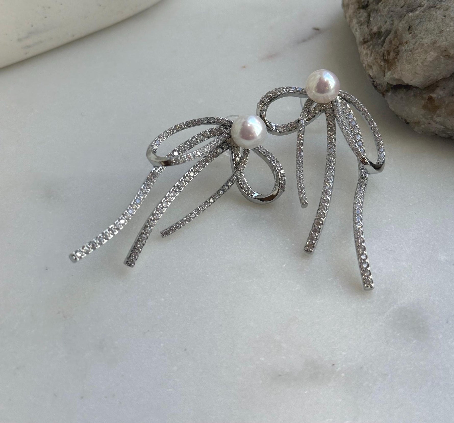 Elly’s 7.7mm white pearls butterfly bow earrings: Extreme luster mirrored, 3x5cm, S925 silver studs copper earrings. Pearl jewelry.gift for her