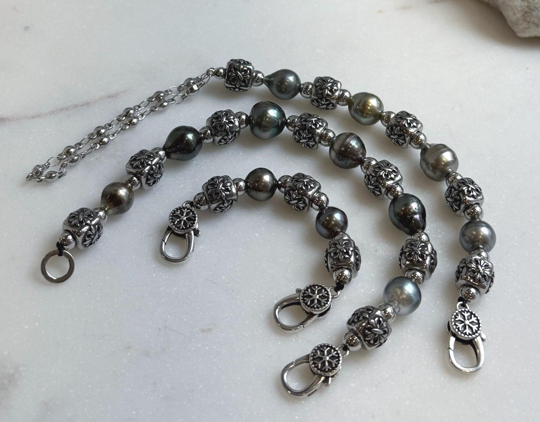 Elly’s 12pcs 8.4-10.6mm cool Tahitian natural peacock ocean pearls necklace strand: extreme luster, 18.7”, S925 silver necklace or bracelet.
