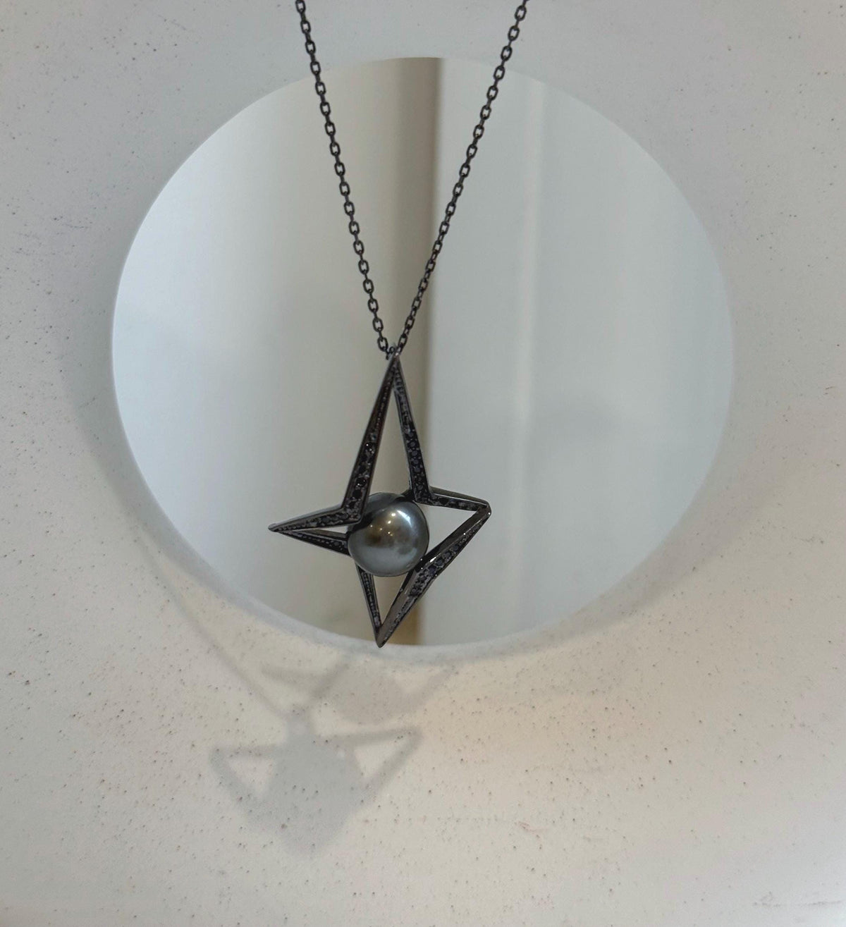 Elly’s 9.5mm Tahitian black ocean pearl Star pendant: Extreme luster mirrored, 2.6x3.8cm, S925 silver pendant chain set.