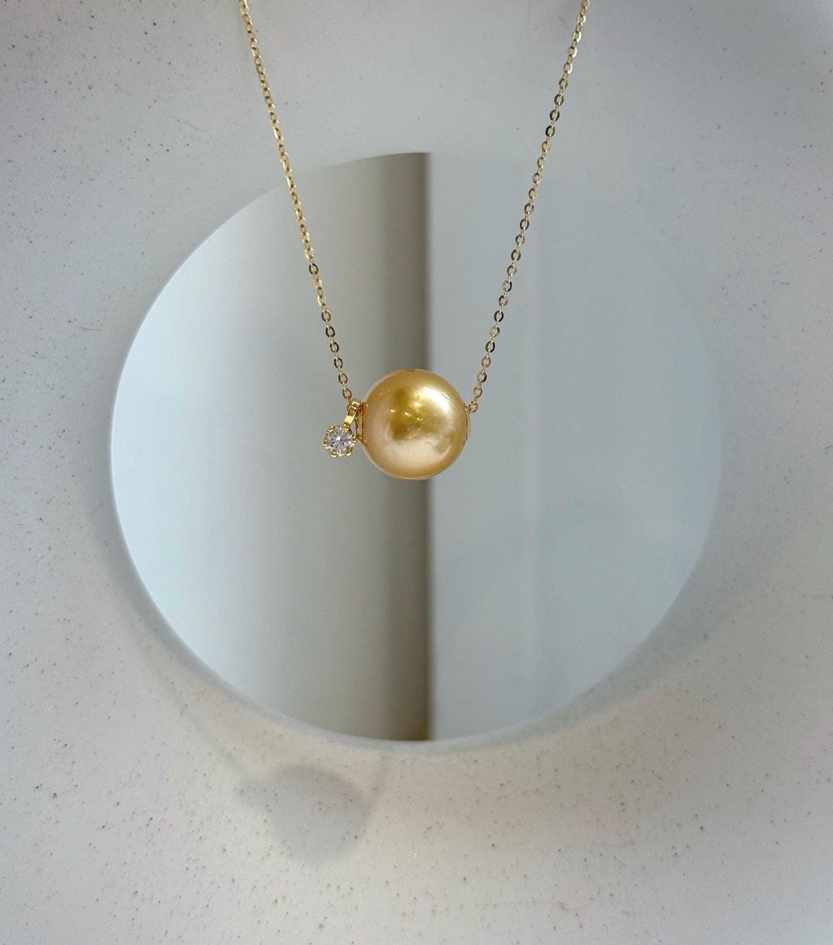 Elly’s Au750 18k Gold 12.8mm South sea deep gold ocean Pearl Floating pendant:Extreme luster mirrored, silver chain.