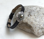 Elly’s 11.7mm Tahitian Platinum Ocean Pearl Genius Leather Strap Bracelet: Extreme luster mirrored, for 6.1”- 8” wrist.