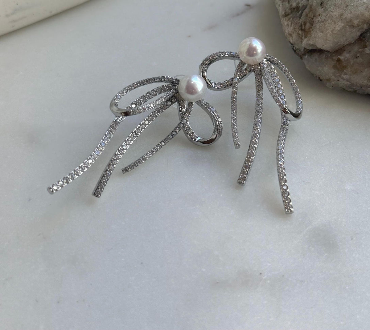 Elly’s 7.7mm white pearls butterfly bow earrings: Extreme luster mirrored, 3x5cm, S925 silver studs copper earrings. Pearl jewelry.gift for her