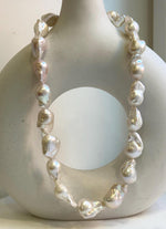 Elly’s 19pcs White Iridescent Baroque Tail pearls necklace strand: Extreme luster mirrored, To 25.2mm. Knotted, 18.5”, S925 silver necklace. high quality baroque pearls necklace for her