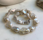 Elly’s 17pcs White Iridescent Baroque Tail pearls necklace strand: Extreme luster mirrored, To 32mm. Knotted, 18.1”, S925 silver necklace. high quality baroque pearls necklace strand gift for her birthday anniversary statement retirement