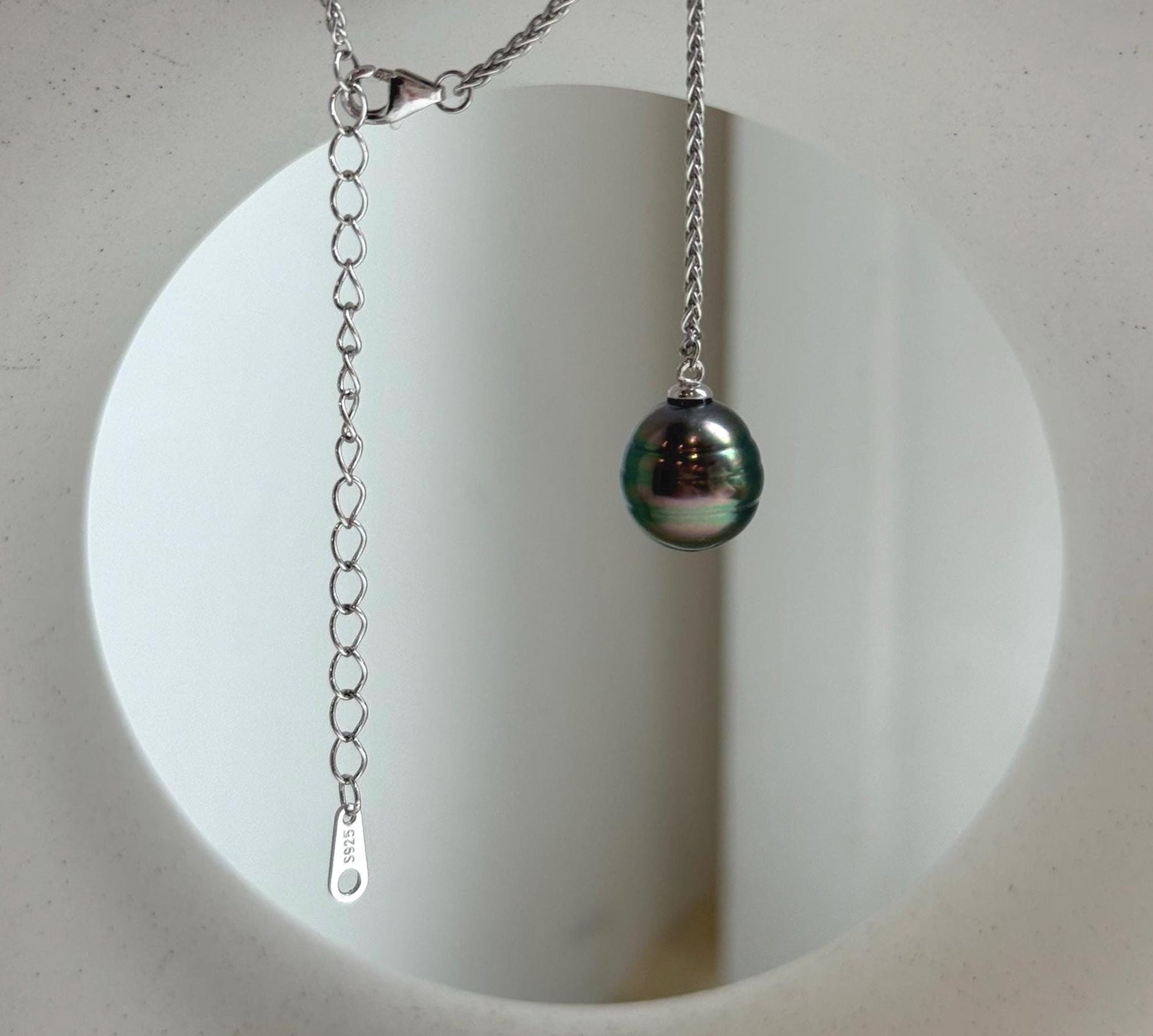 Elly’s 10.2mm Genius Tahitian peacock green ocean pearl Pendant: Extreme luster mirrored, to 20”, s925 silver minimalist pendant chain set.