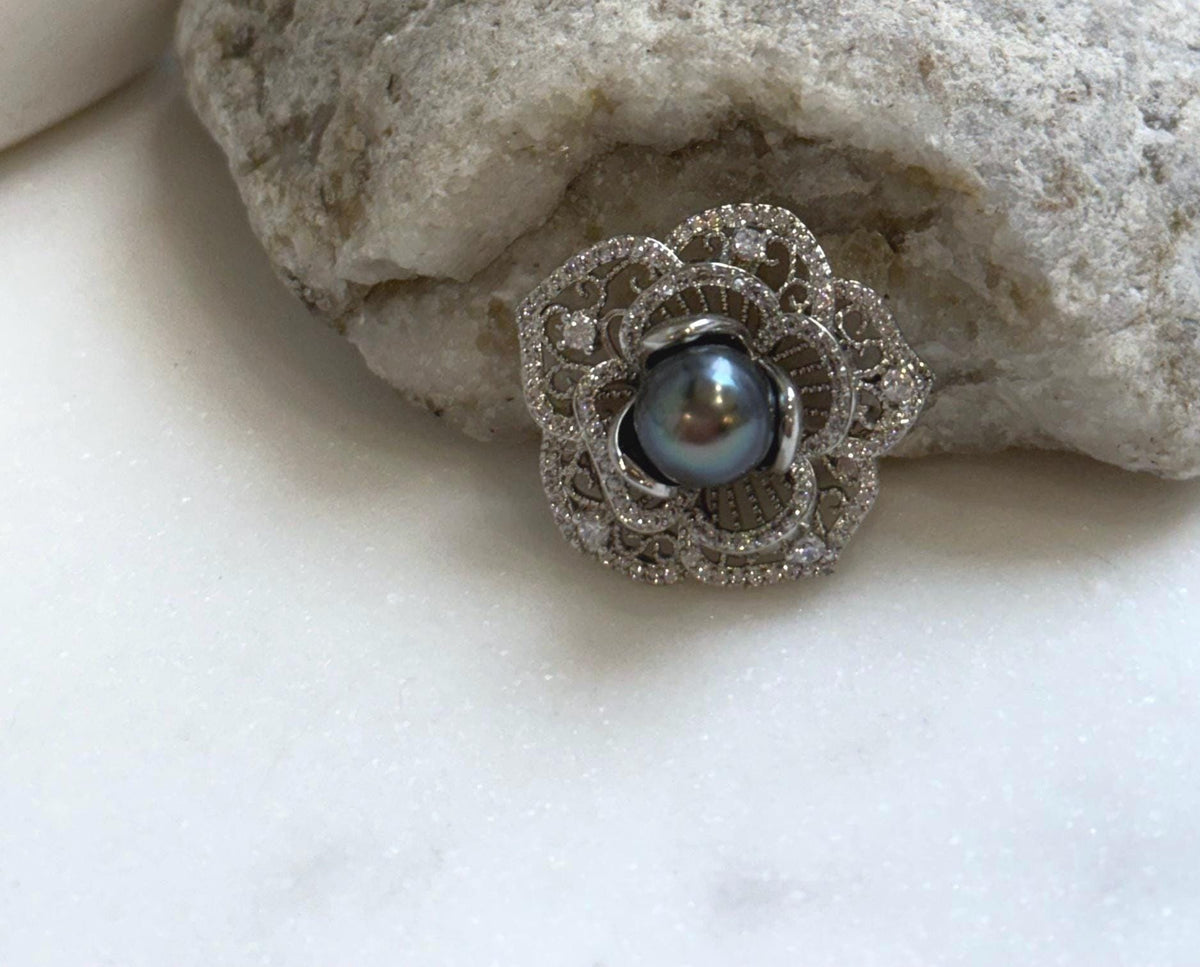 Elly’s 8.8mm Tahitian Hunter Ocean Pearl Floral Brooch: Extreme luster mirrored, 2.6cm dia.