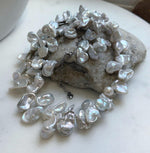 Elly’s Keshi petal white blue iridescent pearls necklace choker: Extreme luster, 19.1”.