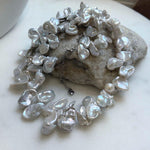 Elly’s large Keshi petal white blue iridescent pearls necklace choker: Extreme luster, 19.1”.