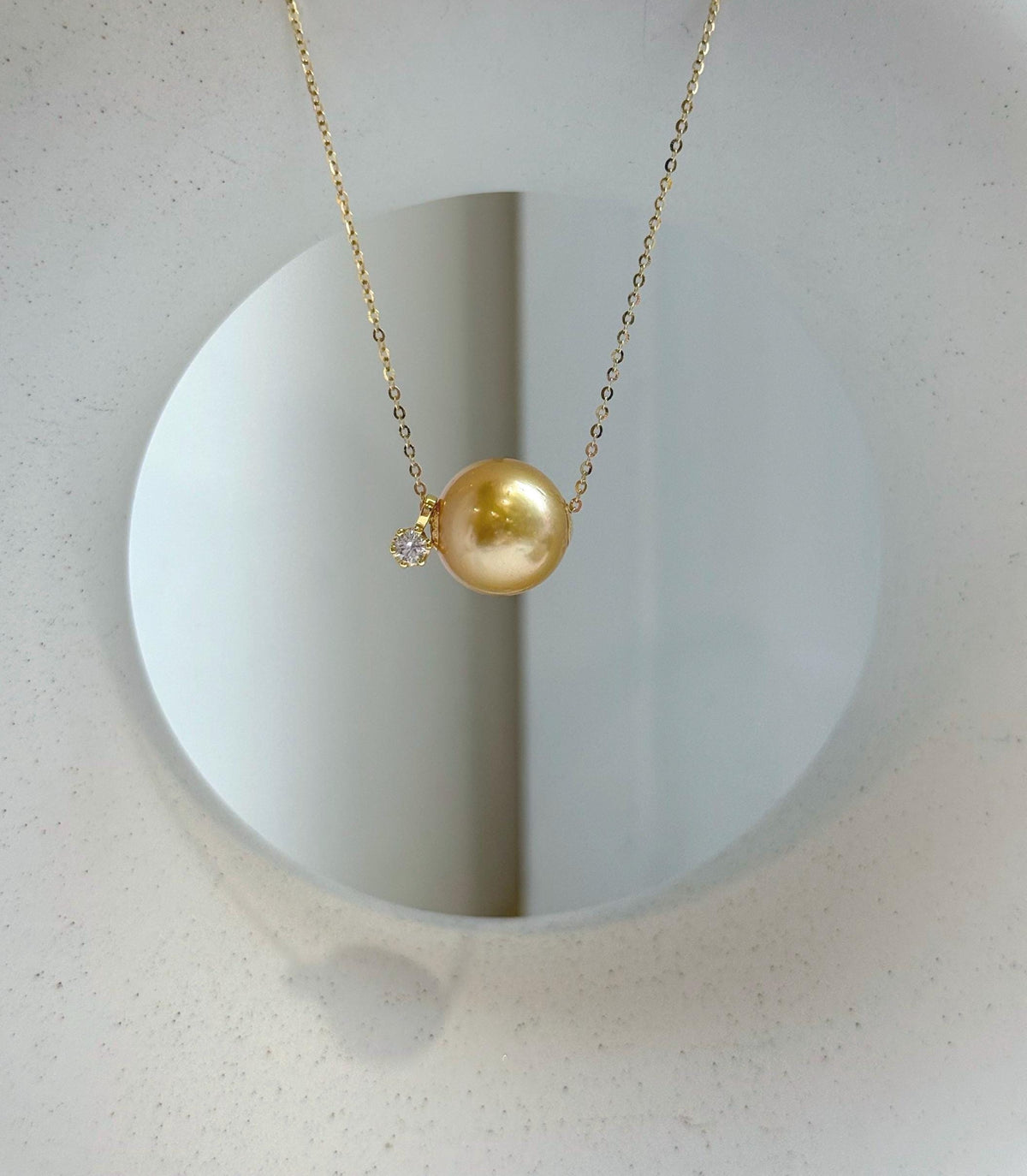 Elly’s Au750 18k Gold 12.8mm South sea deep gold ocean Pearl Floating pendant:Extreme luster mirrored, silver chain.
