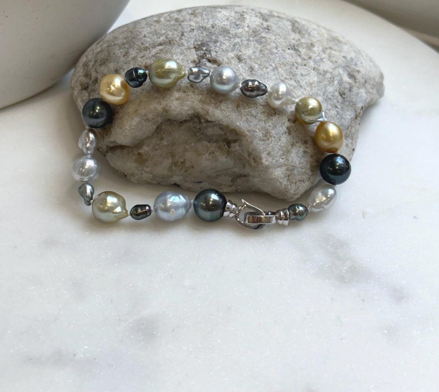 Elly’s Multicolor Ocean Pearls Bracelet: 20pcs South Sea Golden White Tahitian Akoya Pearls, Extreme luster, 3.9-9.4mm, 7.8” knotted, S925 silver bracelet.
