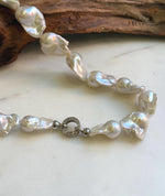 Elly’s 17pcs White Iridescent Baroque Tail pearls necklace strand: Extreme luster mirrored, To 32mm. Knotted, 18.1”, S925 silver necklace. high quality baroque pearls necklace strand gift for her birthday anniversary statement retirement