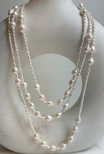 Elly’s 2.5-7.5mm Freshwater white iridescent Keshi pearls Long necklace:Extreme luster mirrored.