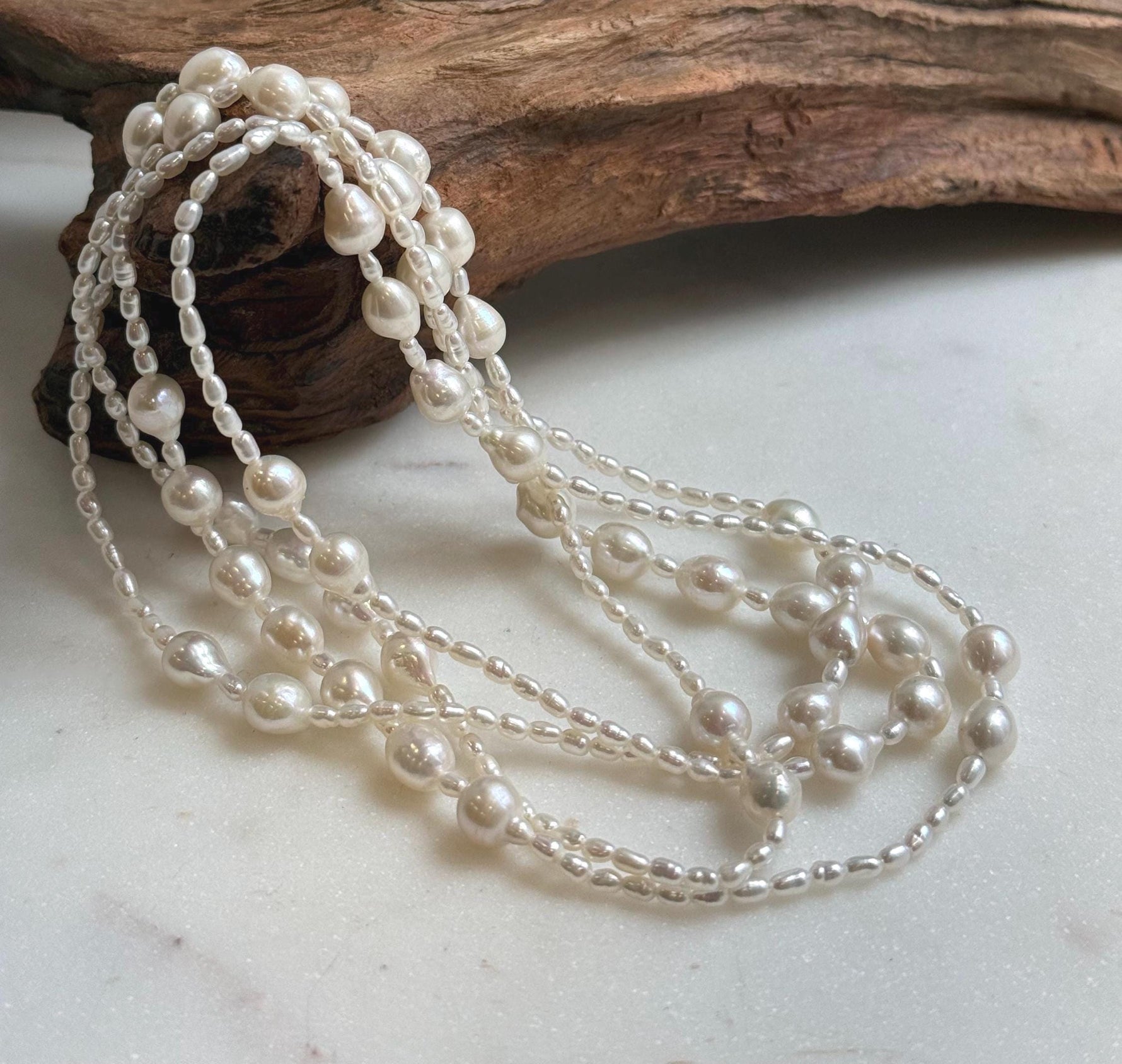 Elly’s 2.5-7.5mm Freshwater white iridescent Keshi pearls Long necklace:Extreme luster mirrored.
