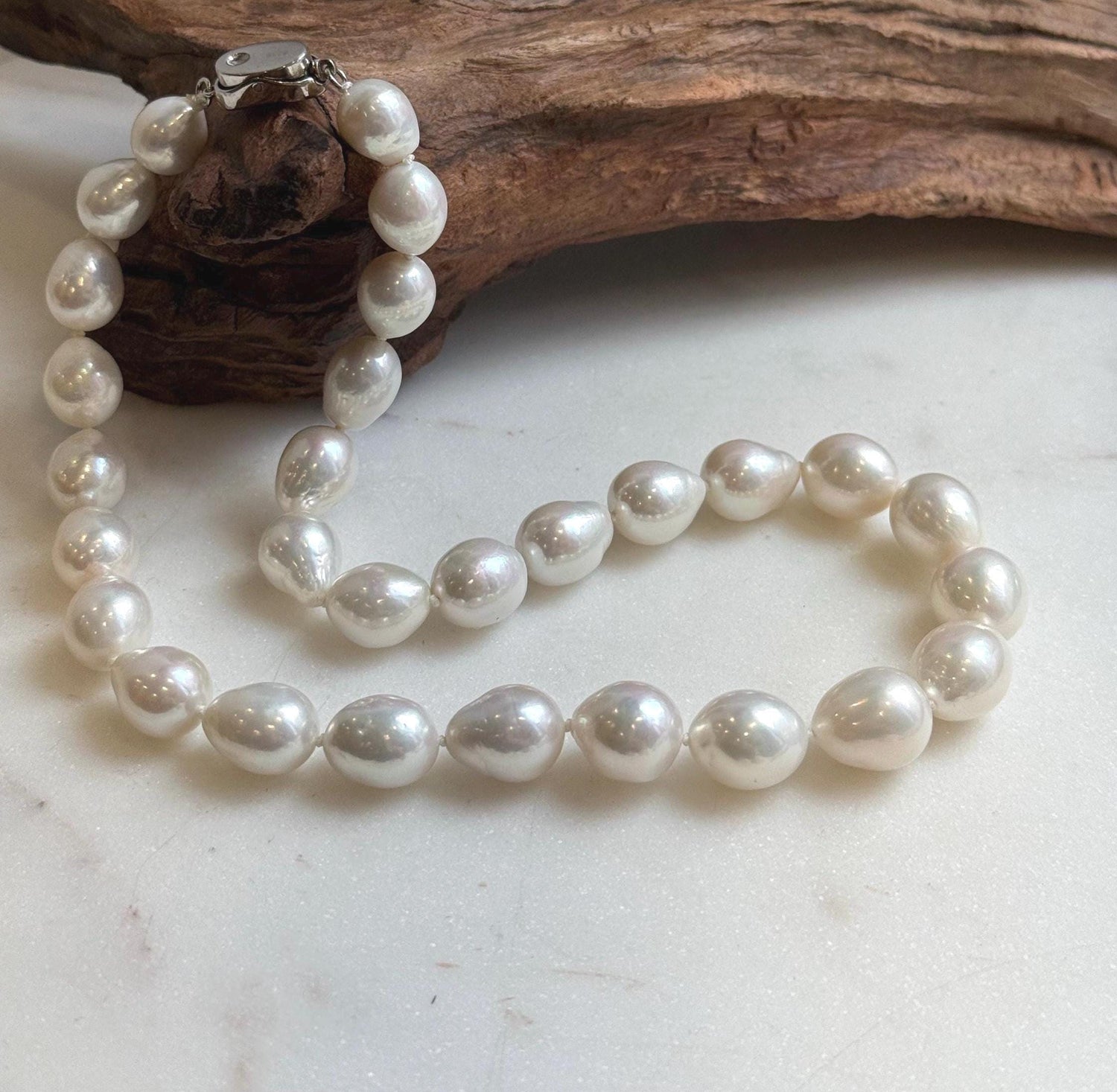 Elly’s 29pcs 10-12.7mm white iridescent Pearls Necklace Strand: Extreme luster mirrored, 17.7”, S925 silver necklace.