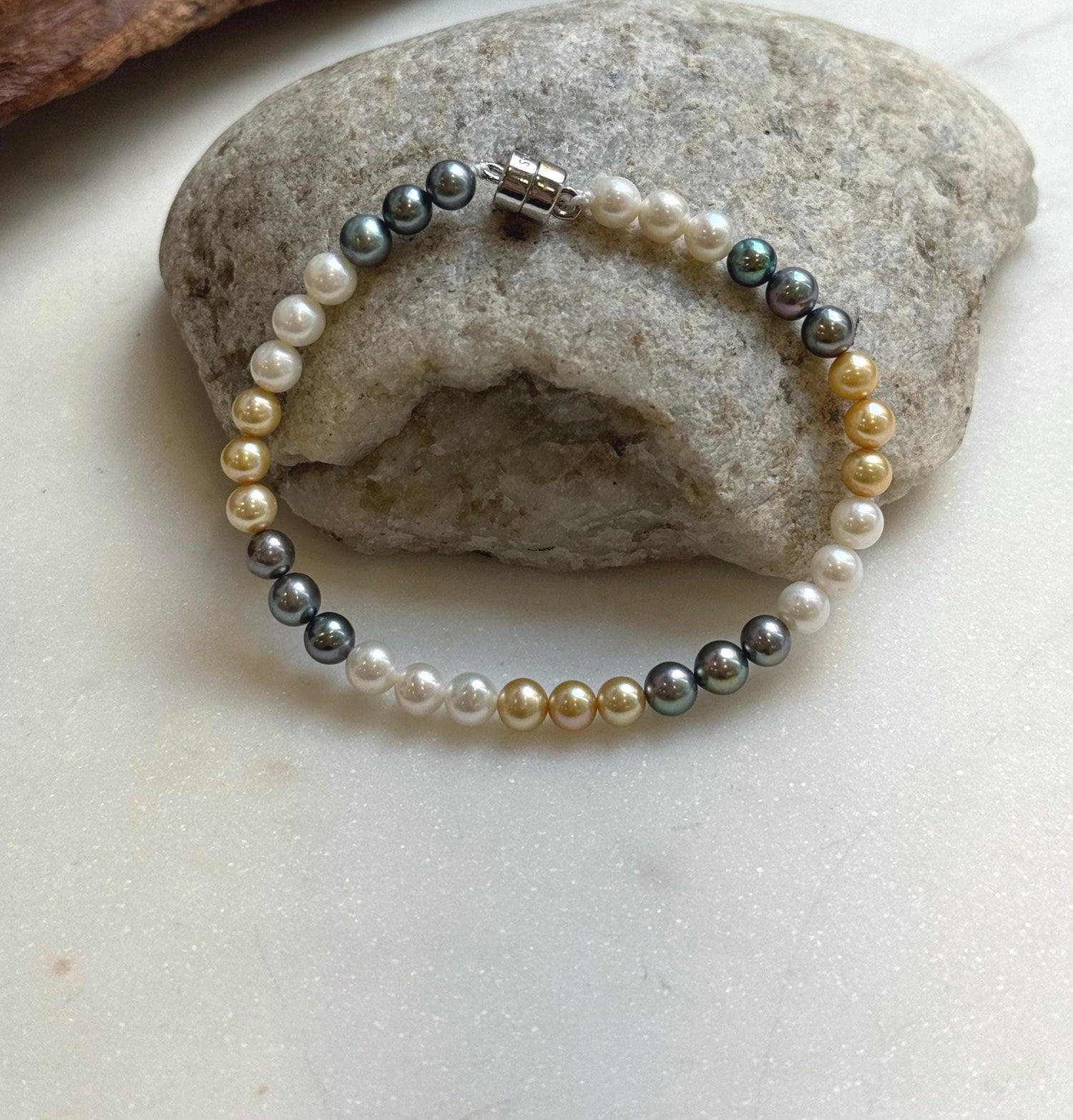 Elly’s 5.2-5.5mm  Freshwater White golden peacock pearls bracelet: Extreme luster mirrored, s925 silver bracelet, different sizes.