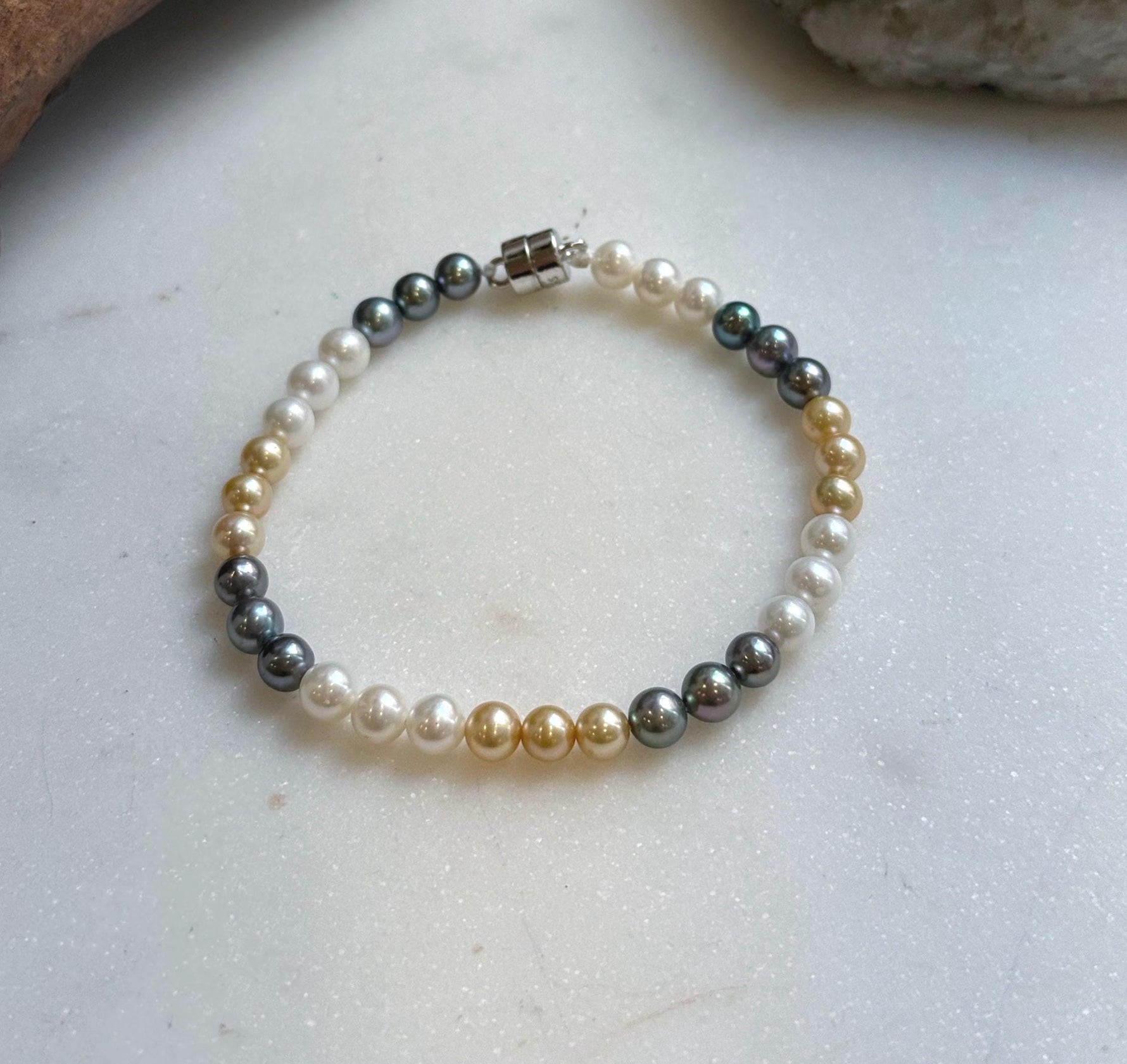 Elly’s 5.2-5.5mm  Freshwater White golden peacock pearls bracelet: Extreme luster mirrored, s925 silver bracelet, different sizes.
