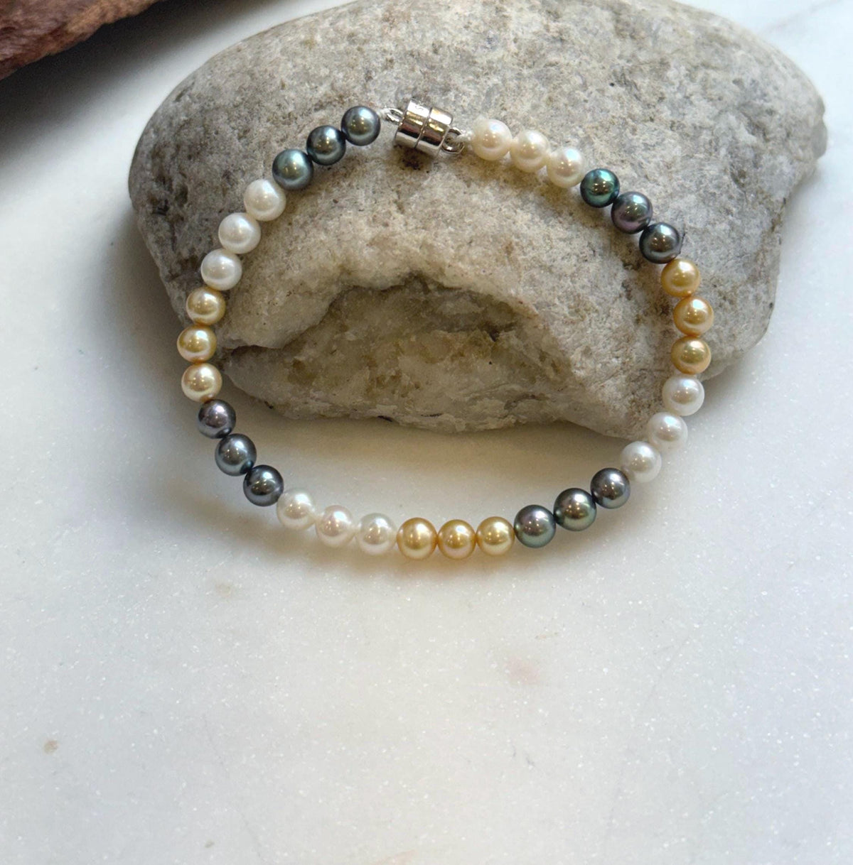 Elly’s 5.2-5.5mm  Freshwater White golden peacock pearls bracelet: Extreme luster mirrored, s925 silver bracelet, different sizes.