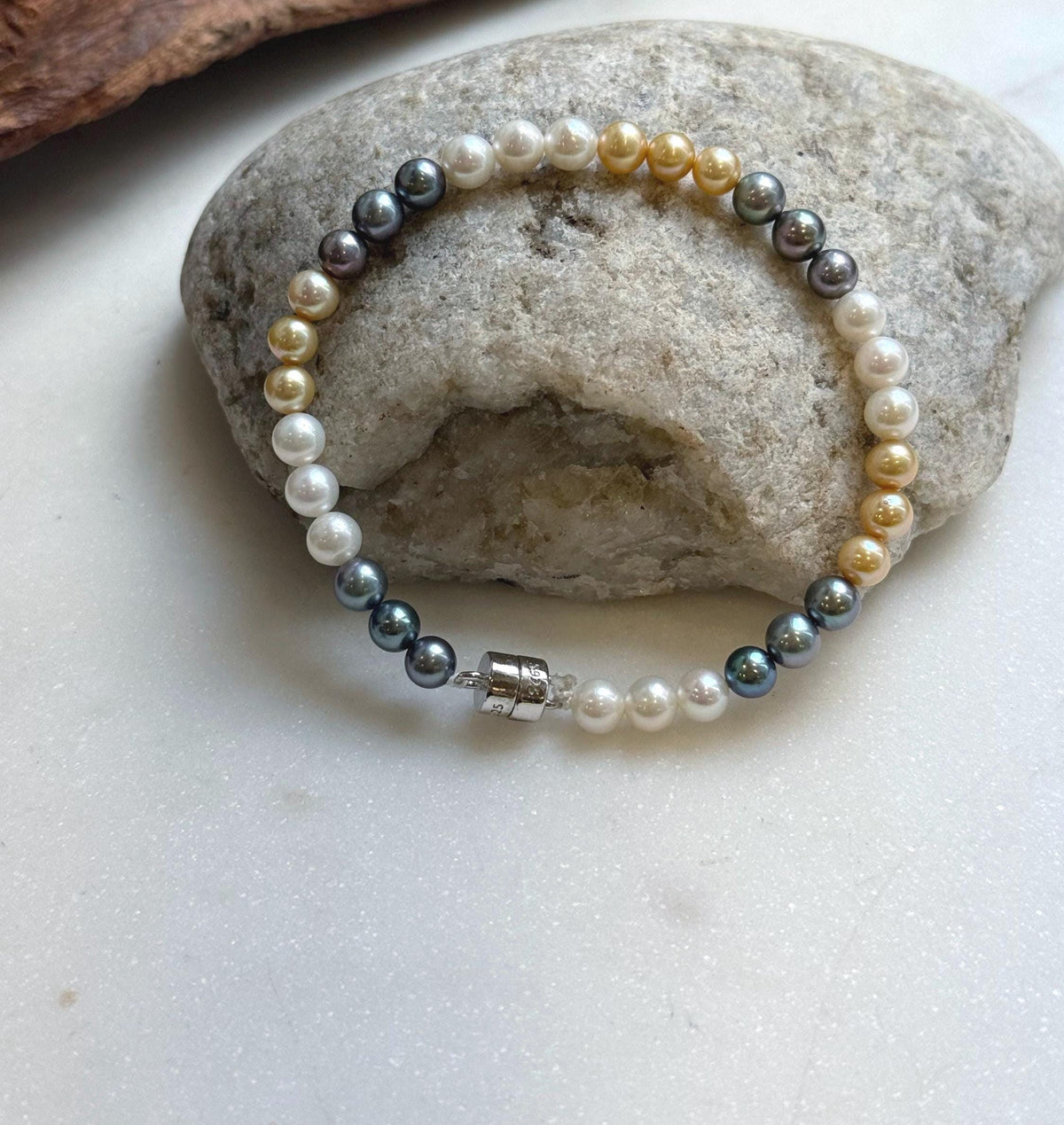 Elly’s 5.2-5.5mm  Freshwater White golden peacock pearls bracelet: Extreme luster mirrored, s925 silver bracelet, different sizes.