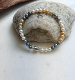 Elly’s 5.2-5.5mm  Freshwater White golden peacock pearls bracelet: Extreme luster mirrored, s925 silver bracelet, different sizes.