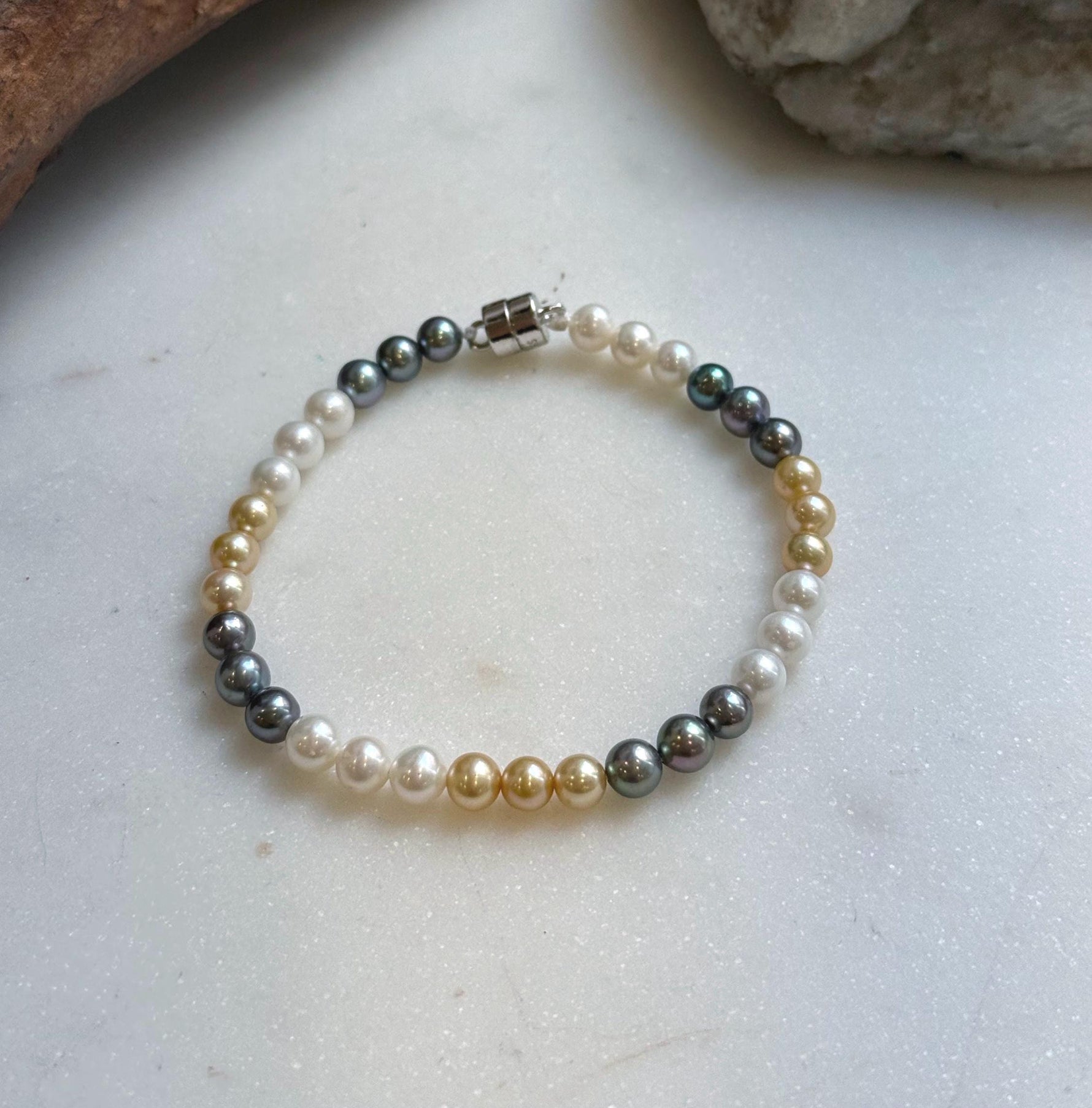 Elly’s 5.2-5.5mm  Freshwater White golden peacock pearls bracelet: Extreme luster mirrored, s925 silver bracelet, different sizes.