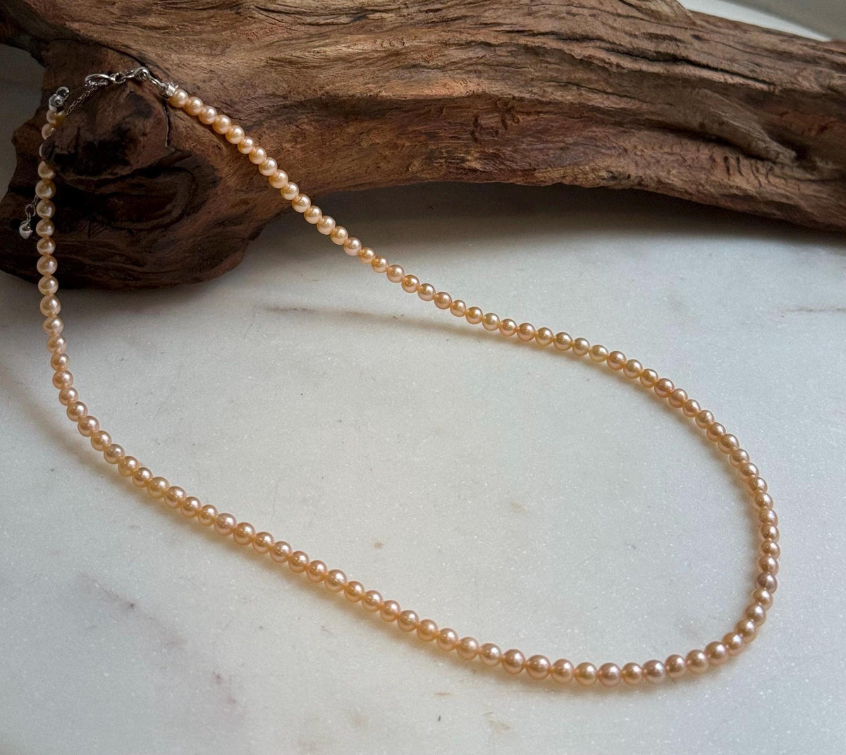 Elly’s 3.6-4mm Freshwater Peach gold Pearls Necklace: Extreme luster mirrored, To 18.3”, S925 silver necklace strand.