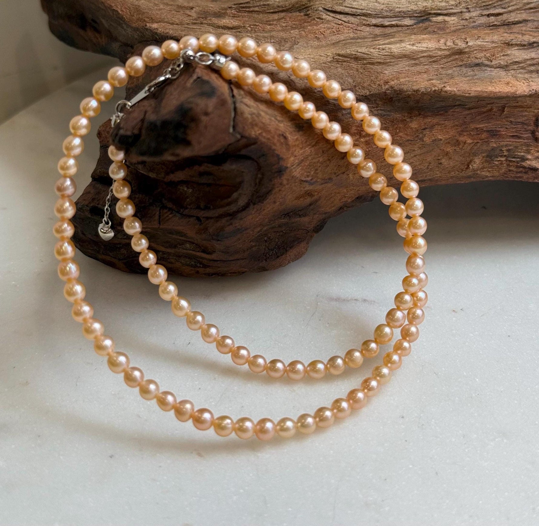 Elly’s 3.6-4mm Freshwater Peach gold Pearls Necklace: Extreme luster mirrored, To 18.3”, S925 silver necklace strand.