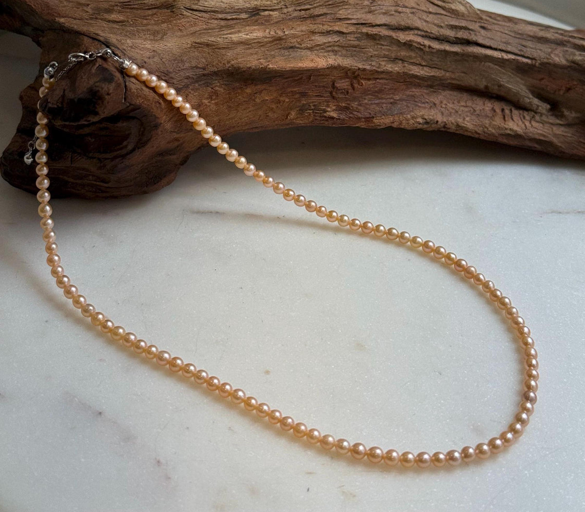 Elly’s 3.6-4mm Freshwater Peach gold Pearls Necklace: Extreme luster mirrored, To 18.3”, S925 silver necklace strand.