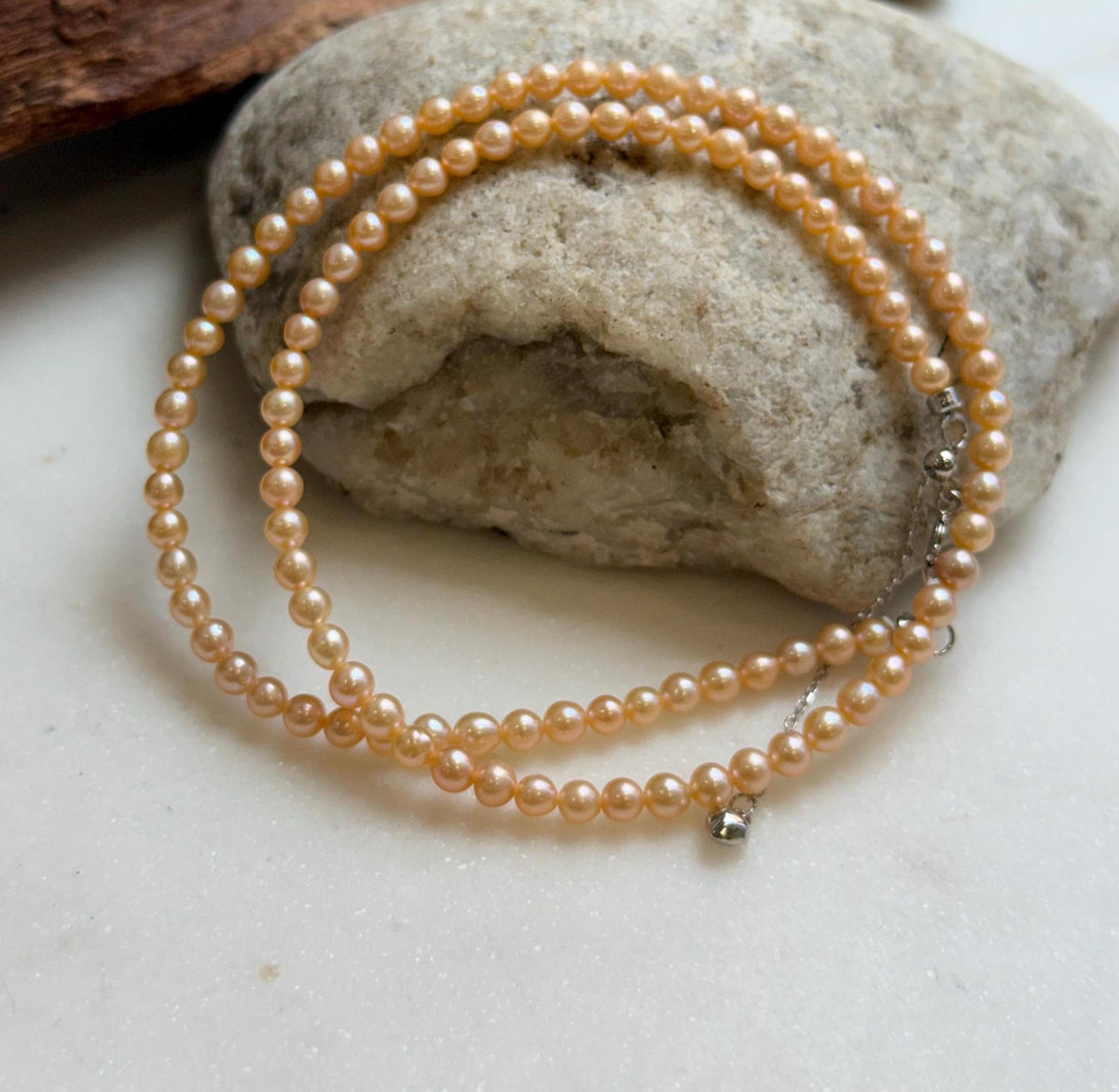 Elly’s 3.6-4mm Freshwater Peach gold Pearls Necklace: Extreme luster mirrored, To 18.3”, S925 silver necklace strand.