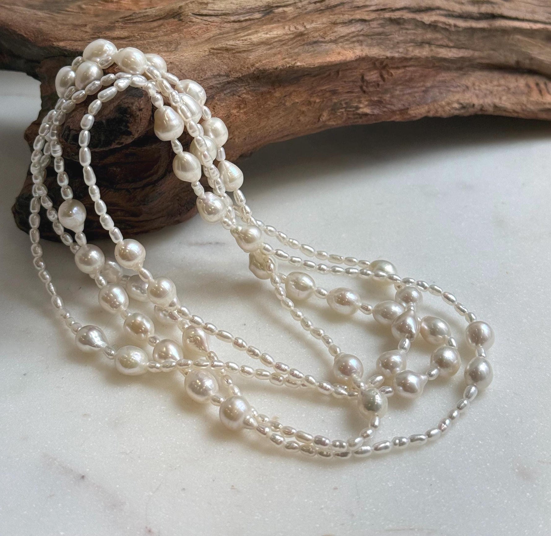 Elly’s 2.5-7.5mm Freshwater white iridescent Keshi pearls Long necklace:Extreme luster mirrored.